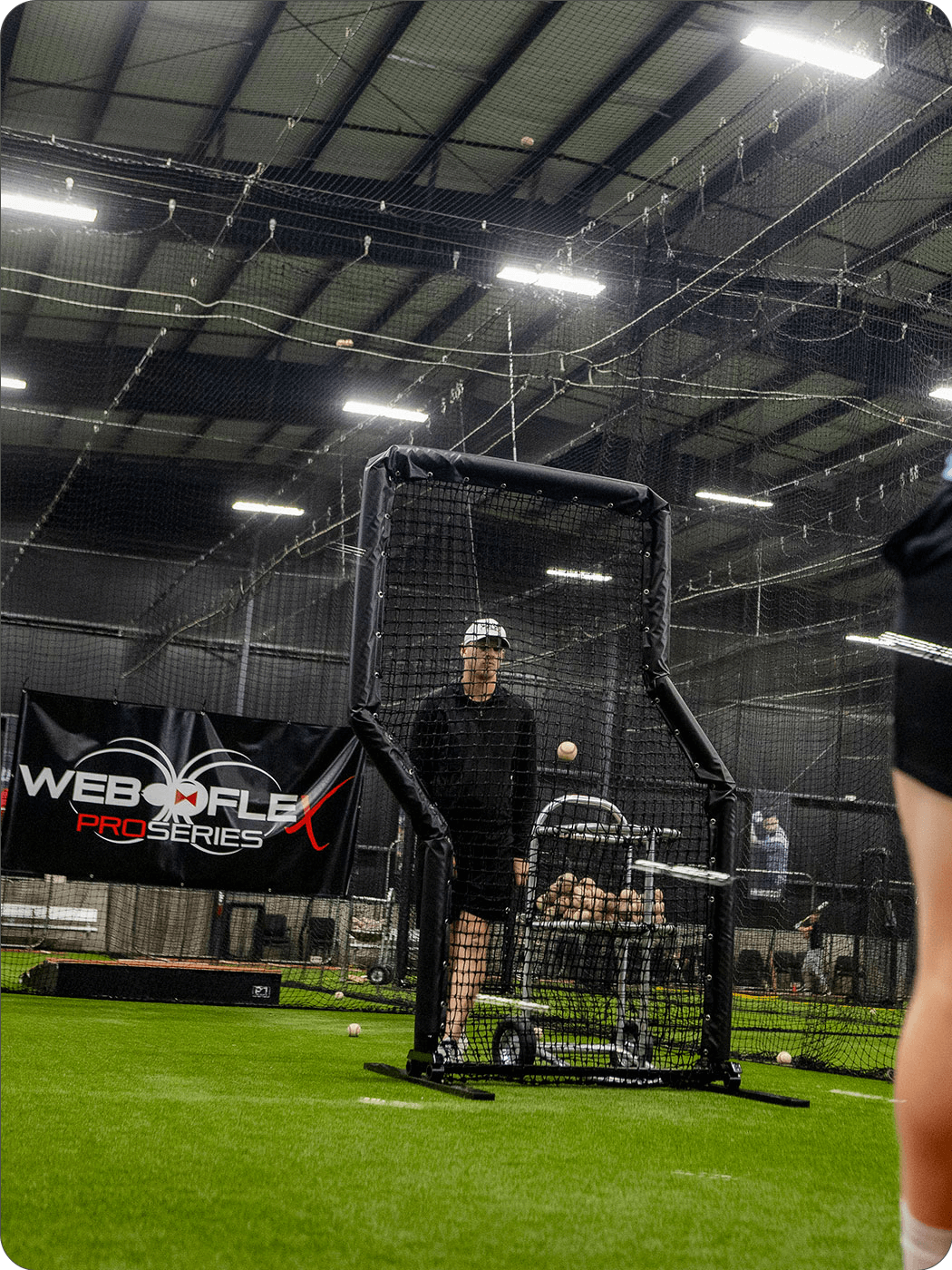 Parker Bridwell pitching behind a Web Flex Screen